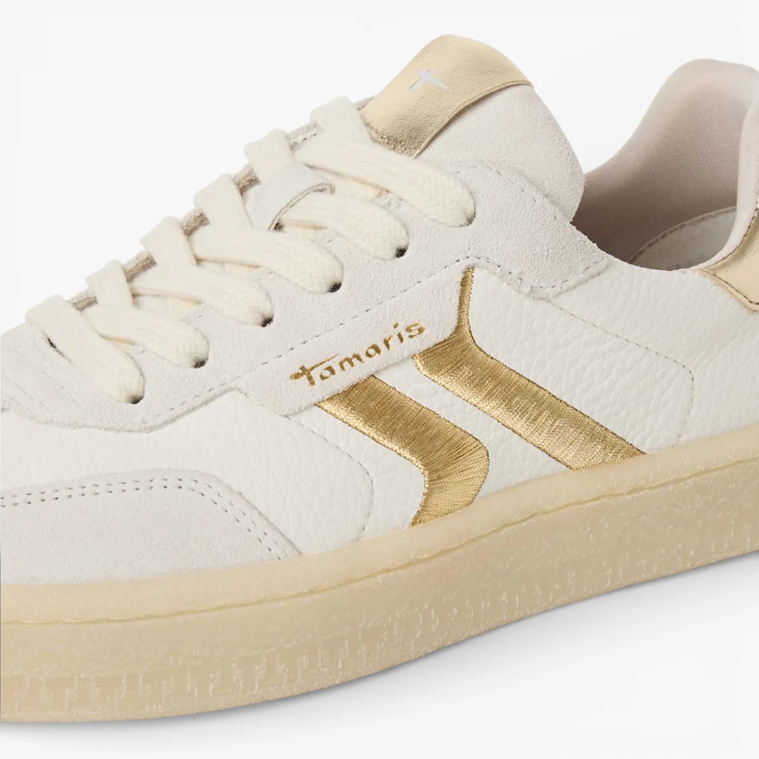 Close-up detail of Tamaris trainer gold trim