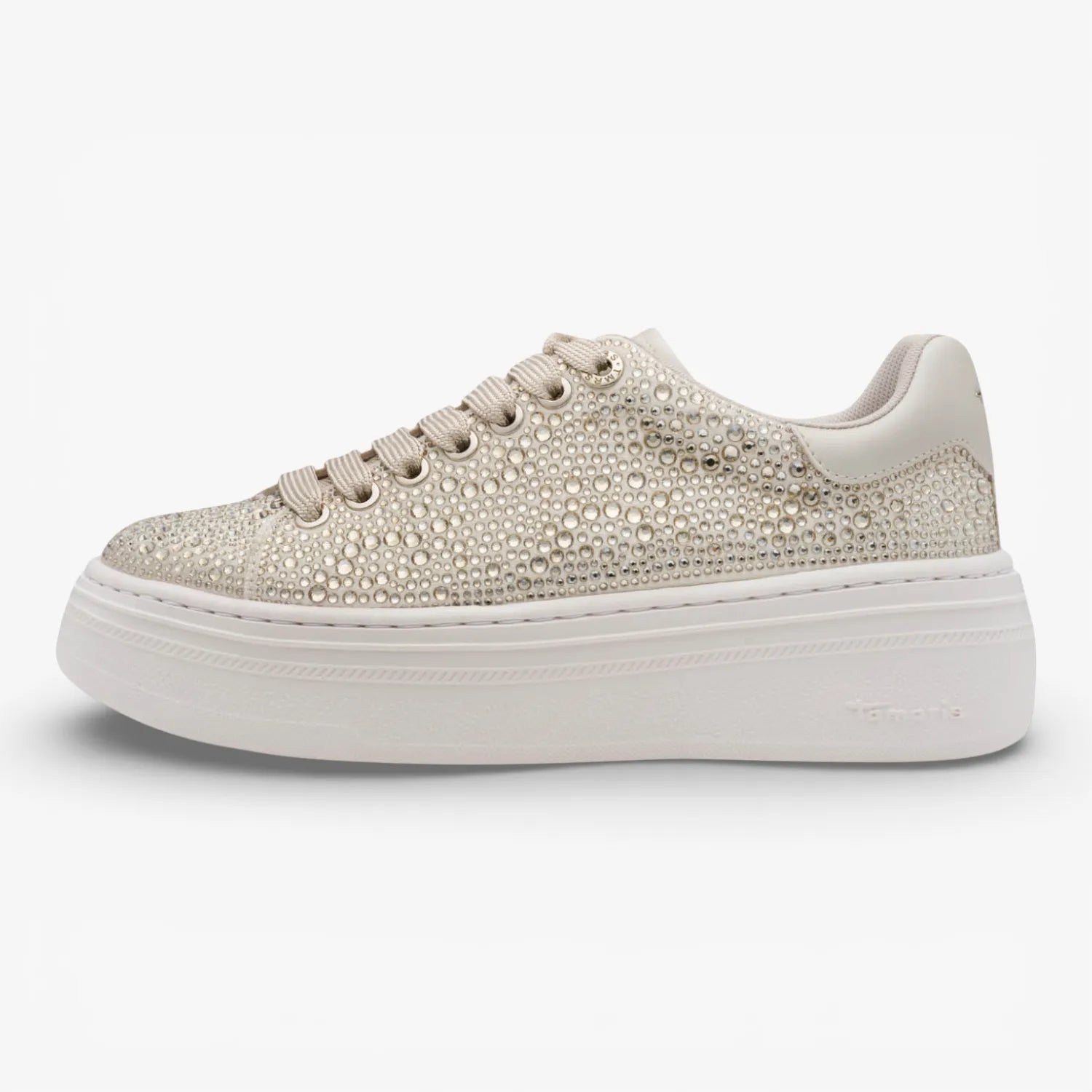 Gold embellished sneaker on a white background
