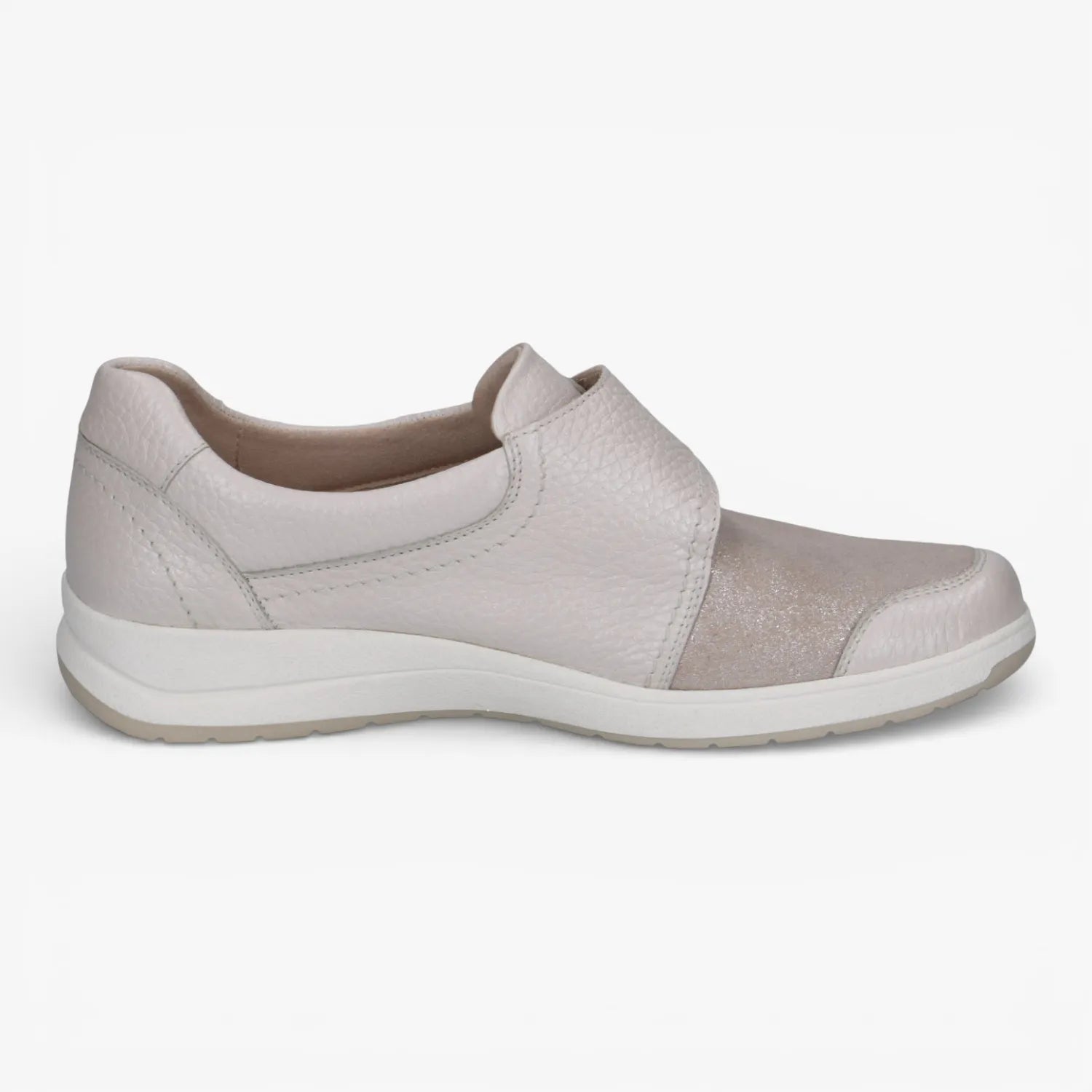 Light gray slip-on shoe with a white sole on a light gray background