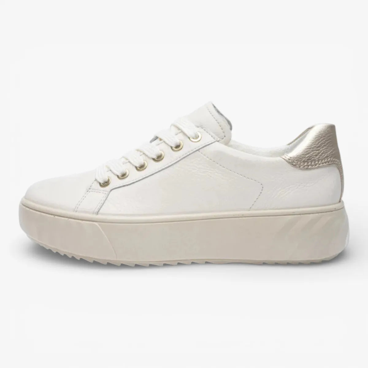 White sneaker with a platform sole on a white background