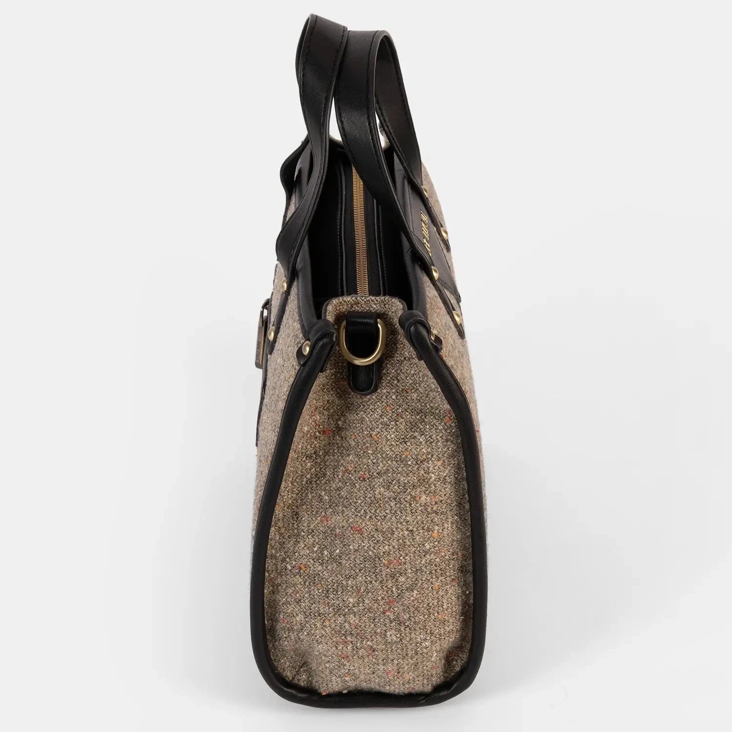 Handbag with tweed pattern and black leather accents on a white background