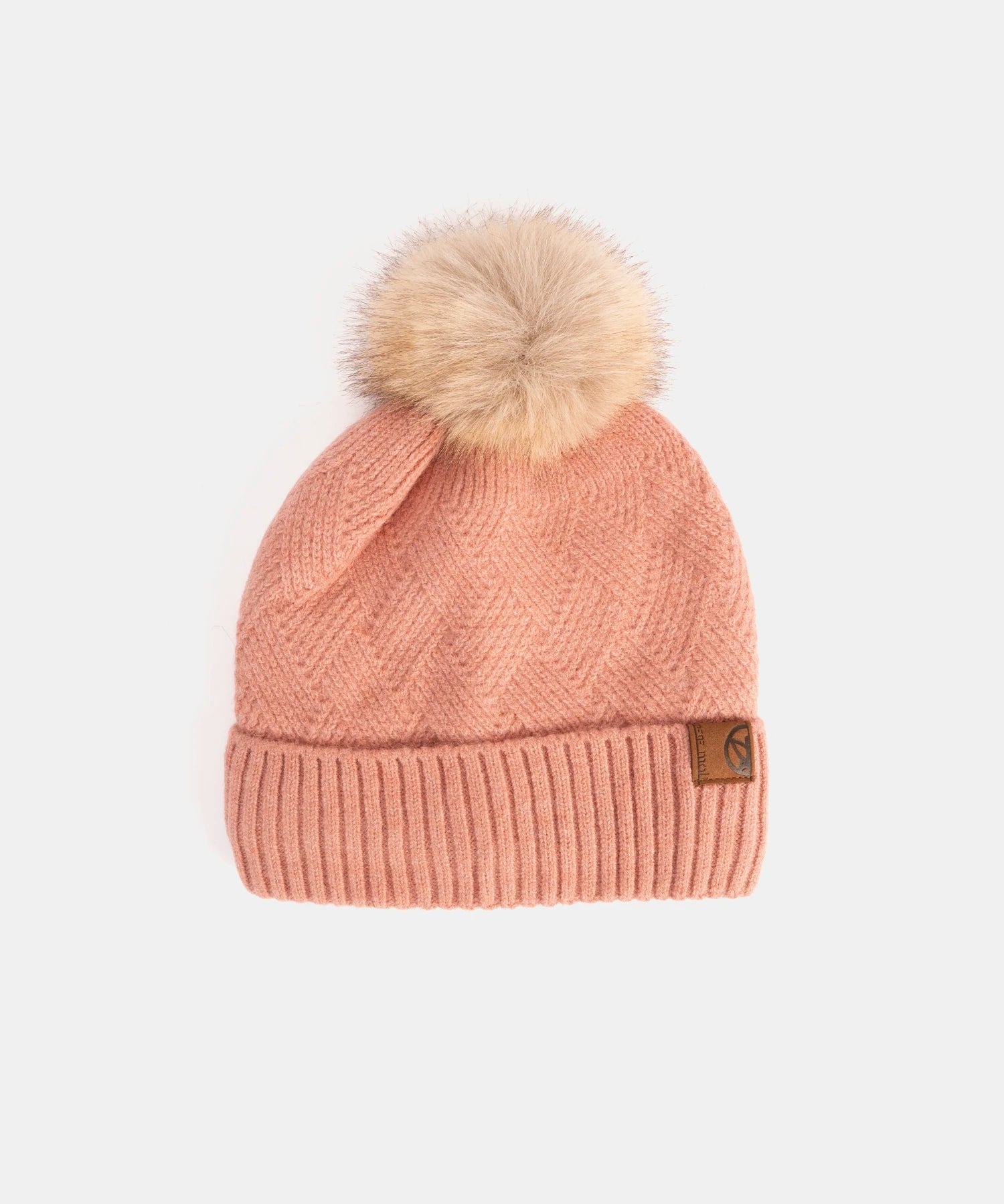 Pink knit beanie with a fur pom-pom on a white background