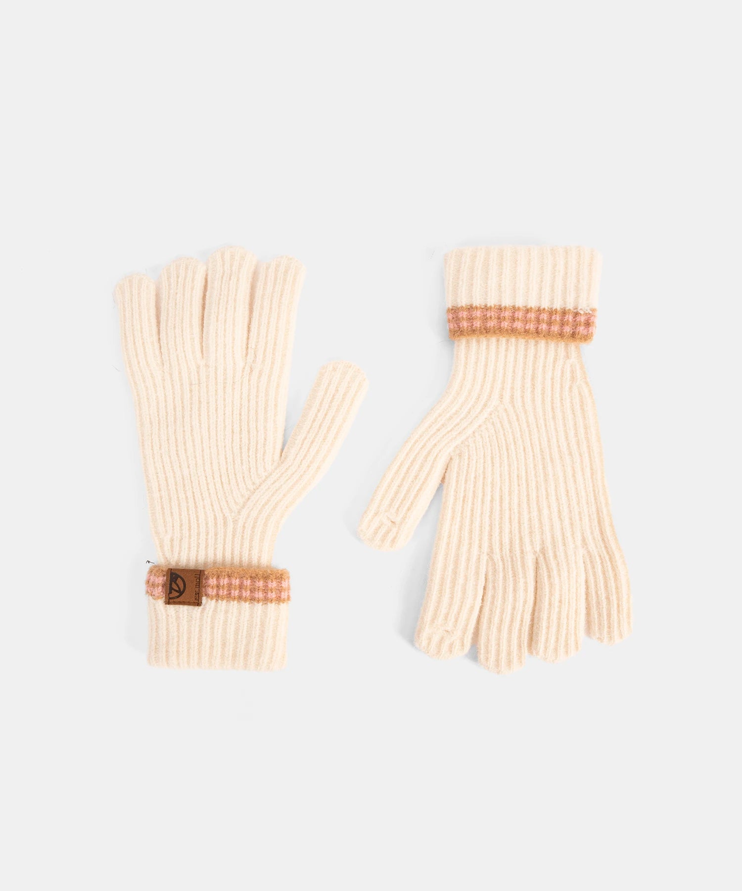 Pair of cream-colored gloves with brown accents on a light gray background