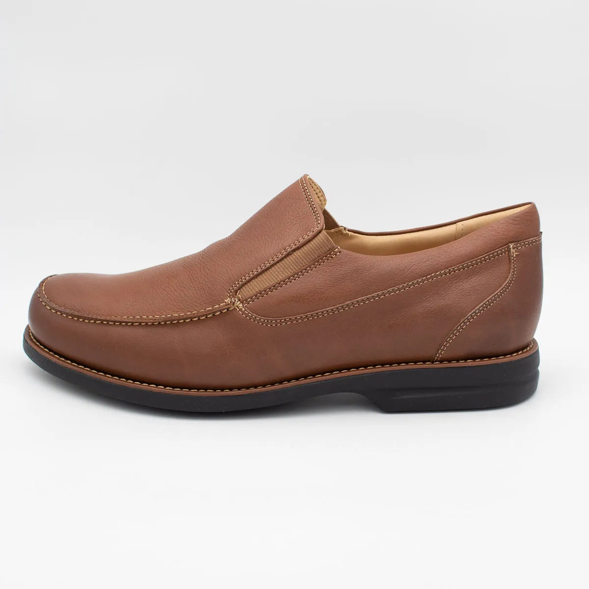 Brown leather slip-on shoe on a white background