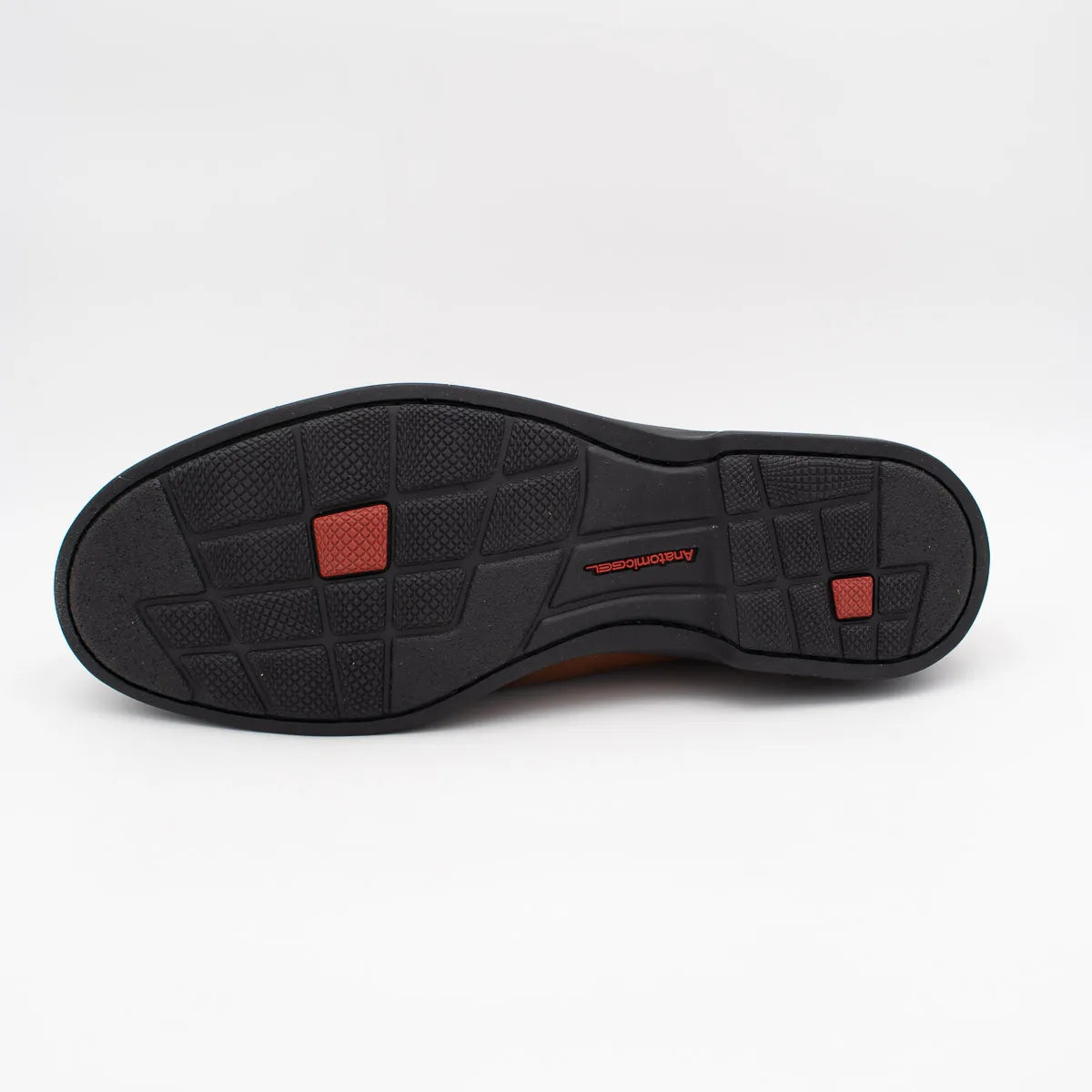 Black shoe sole with red accents on a white background