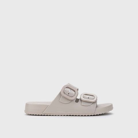 Beige sandal with double straps on a light gray background