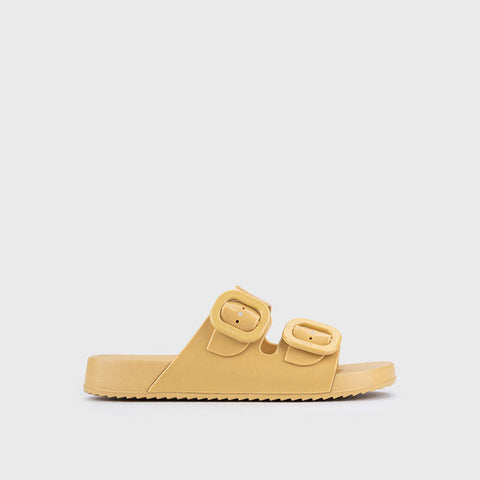 Yellow sandal with double straps on a light gray background