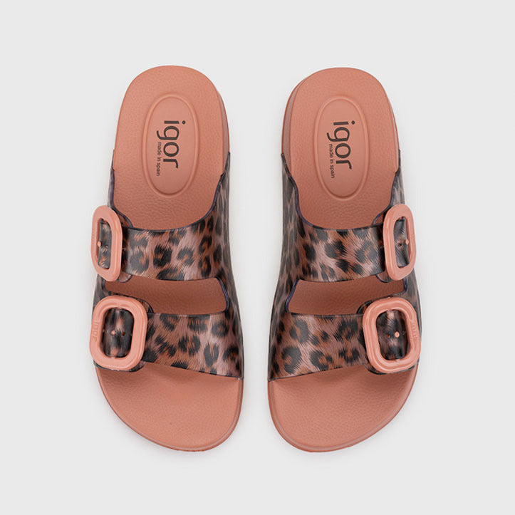 Pair of leopard print sandals with pink straps on a white background