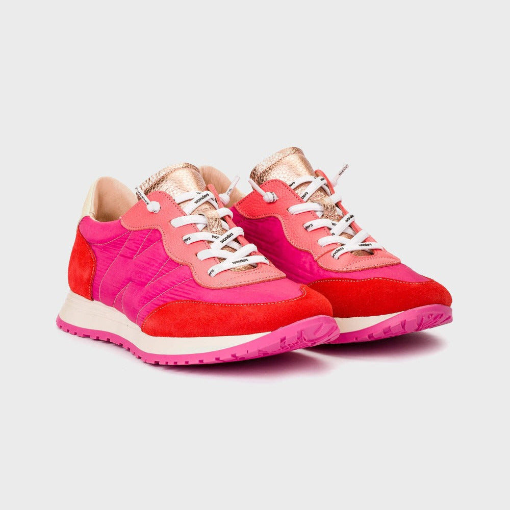 Pink and red sneakers on a light gray background
