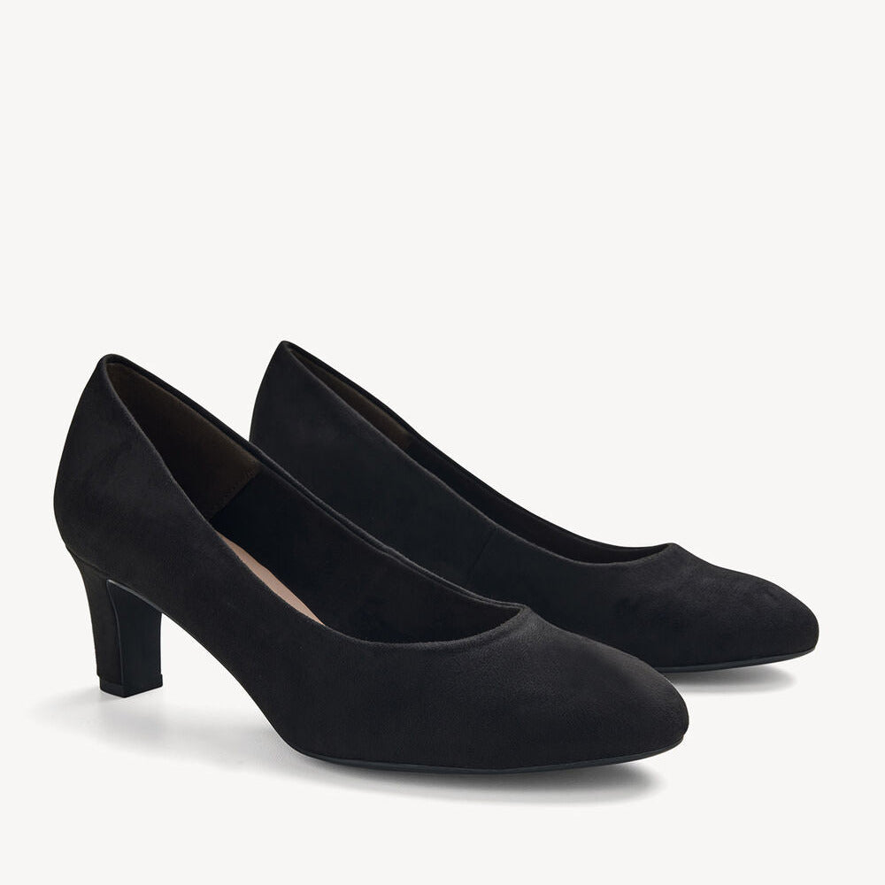 A pair of black pointed-toe pumps with a block heel, made from a matte black fabric like suede or micro-suede, shown on a clean off-white background.