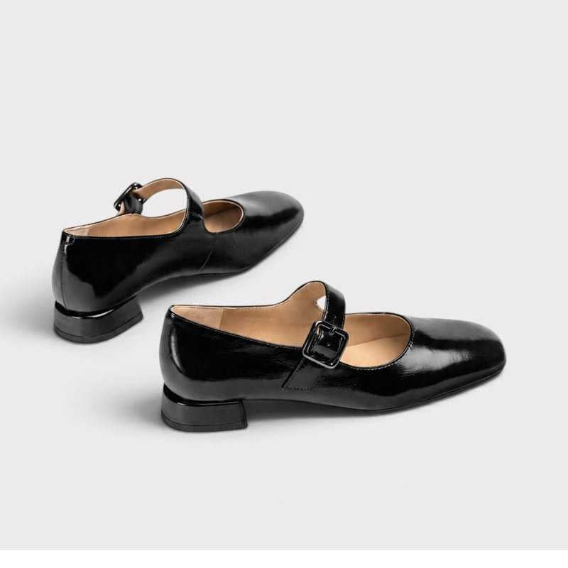 Unisa Culver black patent Mary Jane shoes showing the rear heel shape and adjustable straps
