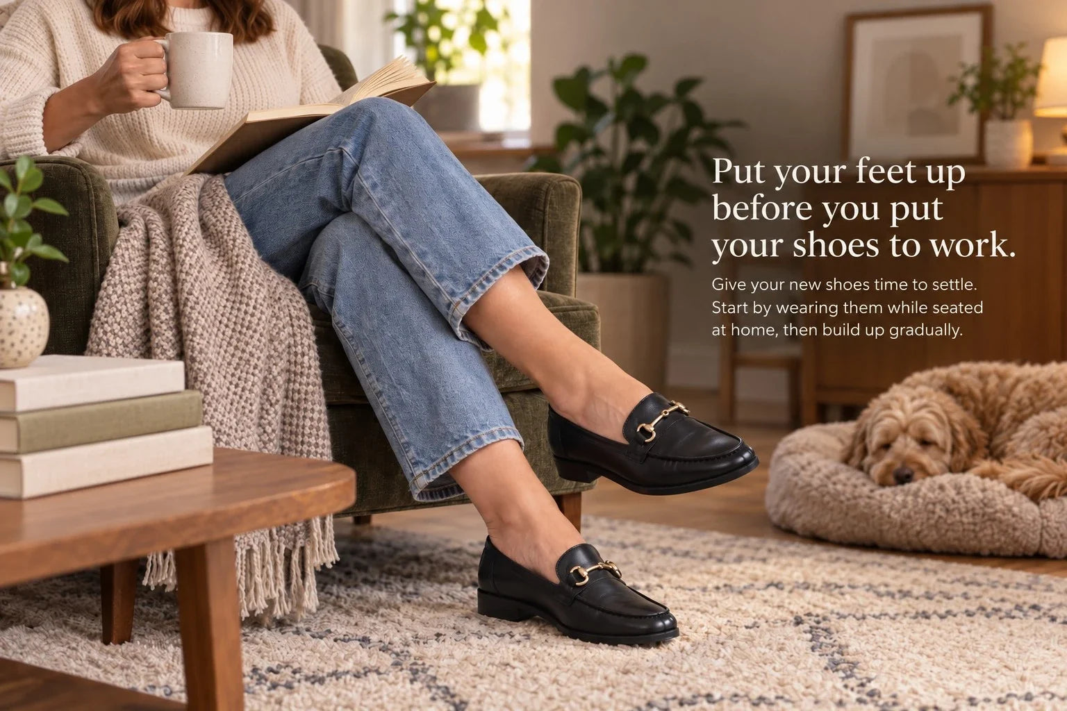 Woman relaxing at home while wearing new black loafers to gradually break them in before longer wear.