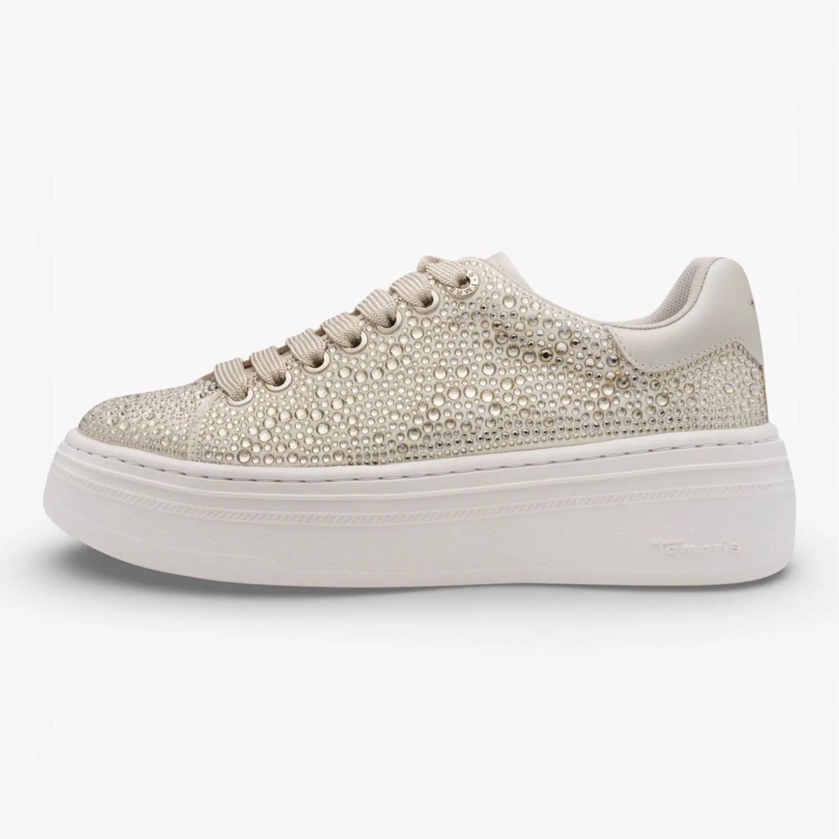 Gold embellished sneaker on a white background