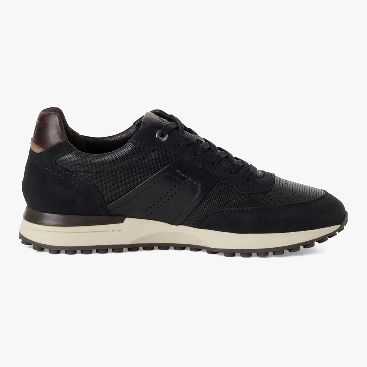 Inner side of the Marco Tozzi navy MT Sport trainer, showing the brown heel accent.