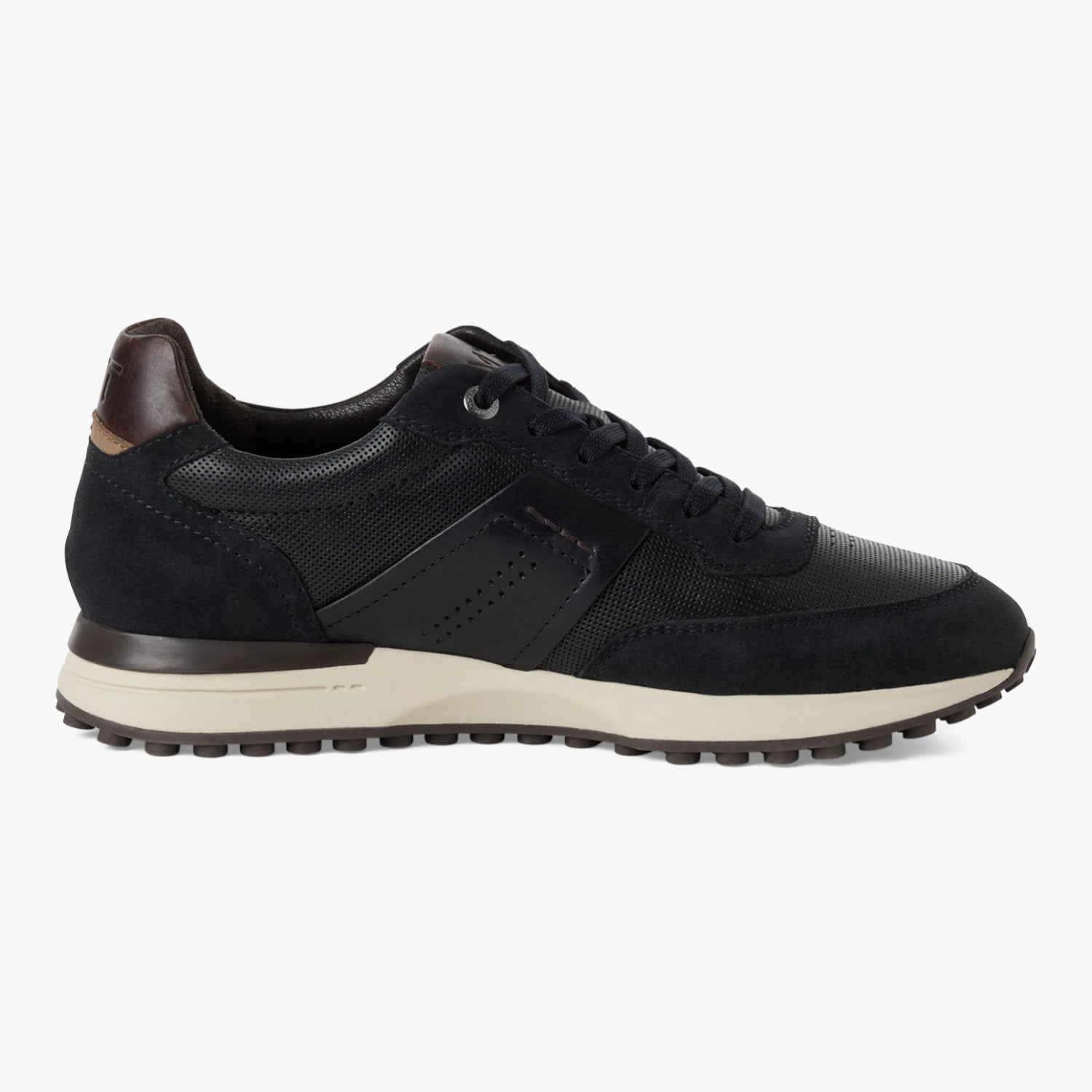 Inner side of the Marco Tozzi navy MT Sport trainer, showing the brown heel accent.