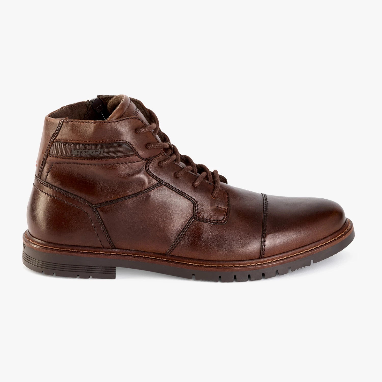 Outer side of the Marco Tozzi dark brown leather boot, showing the low heel and panelled stitching.