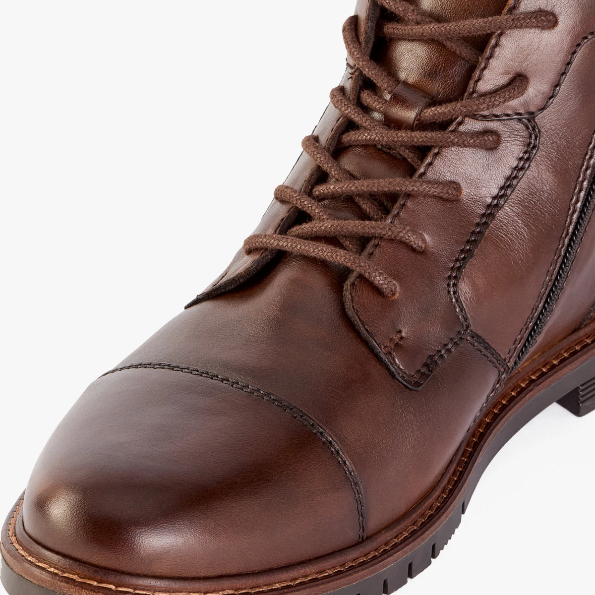 Close-up of the toe cap, lacing and leather panels on the Marco Tozzi dark brown boot.