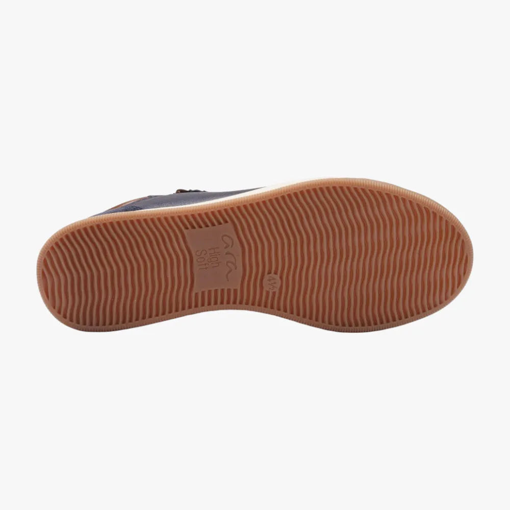 Close-up of a shoe sole with a brand logo on a white background