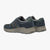 Pair of blue casual shoes with beige soles on a white background