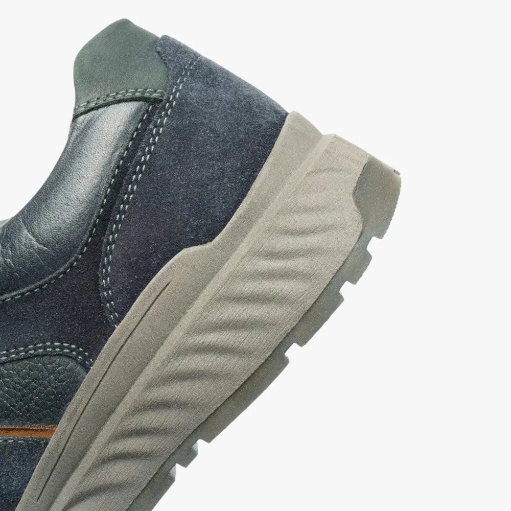 Navy blue shoe with a beige sole on a white background