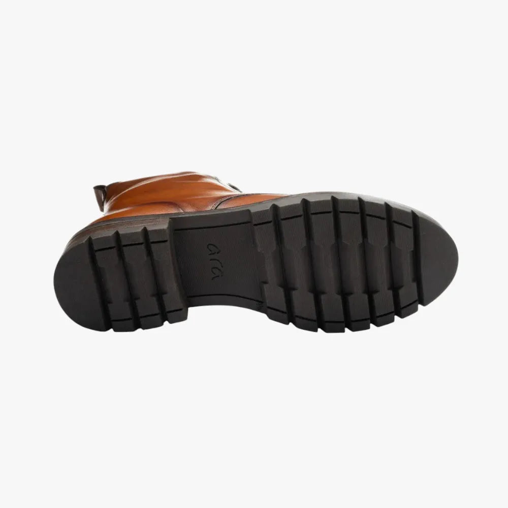 Brown leather boot with black sole on a white background