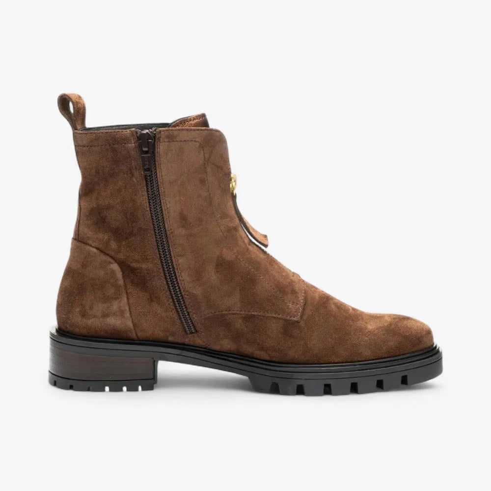 Brown suede boot with a zipper on a white background