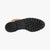 Close-up of a boot sole with tread pattern on a white background