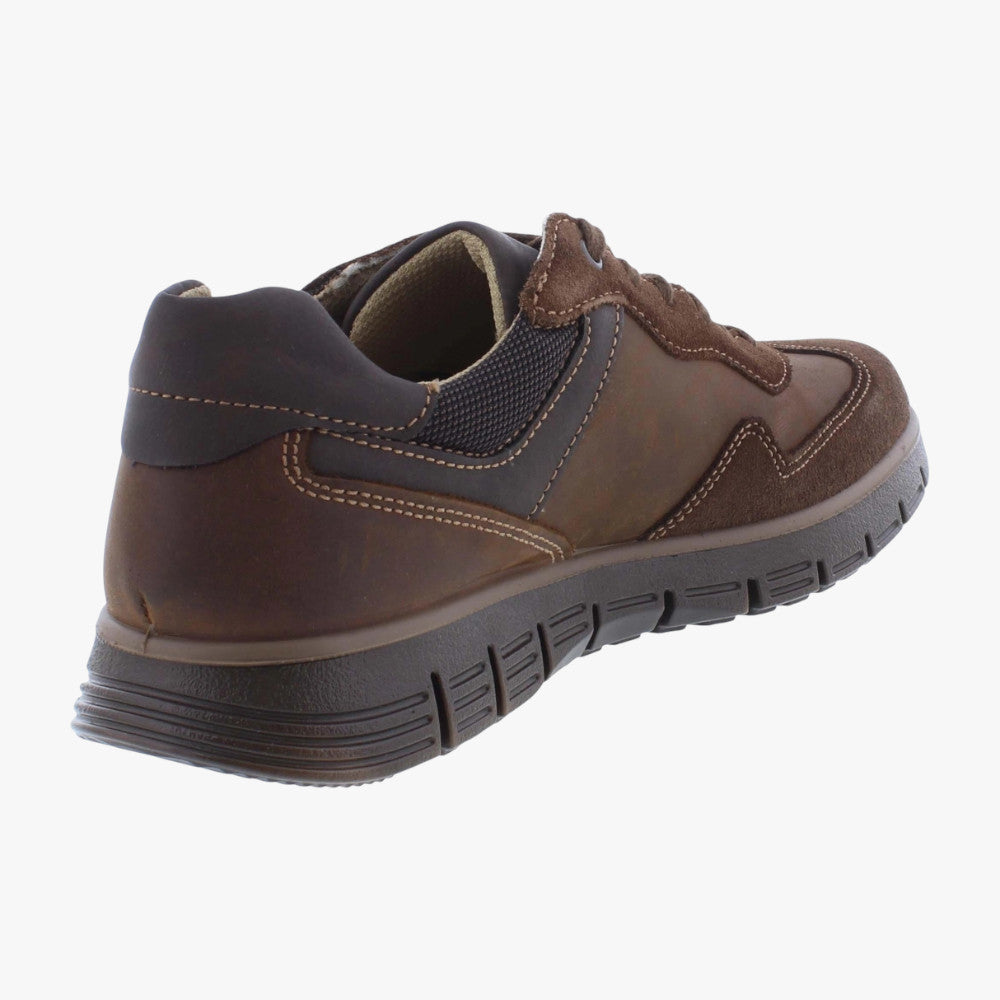 Brown children's shoe on a white background