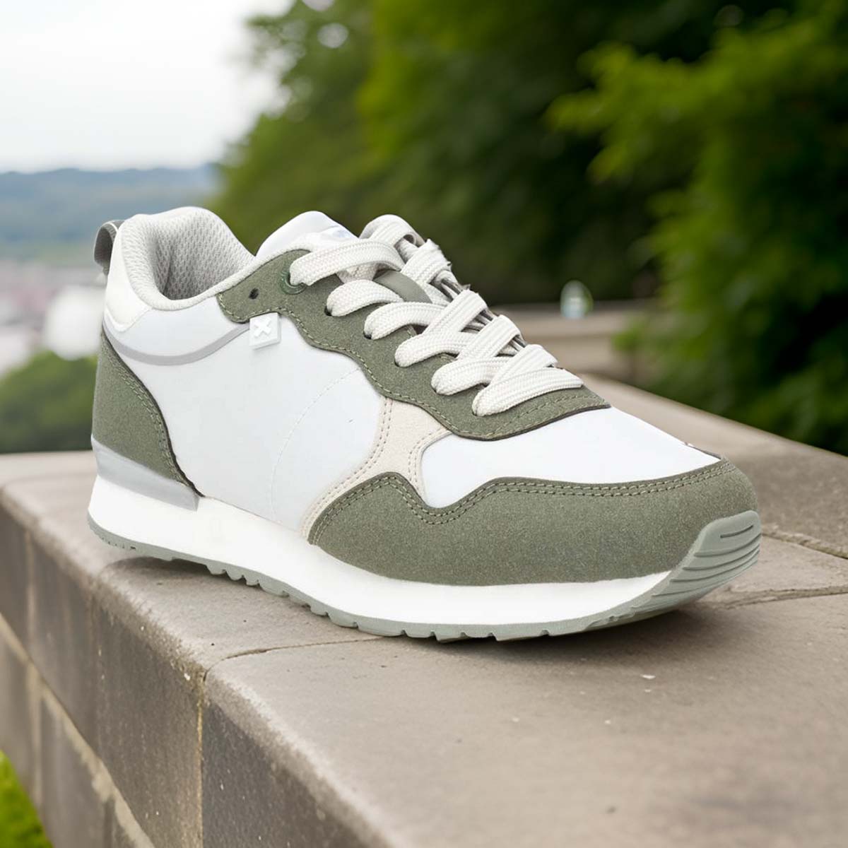     Front view of XTI Vegan Certified Runners in white, olive green, and soft grey.