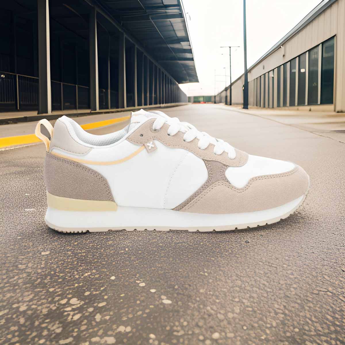     Front view of XTI Vegan Certified Runners in white, beige, and soft yellow.
