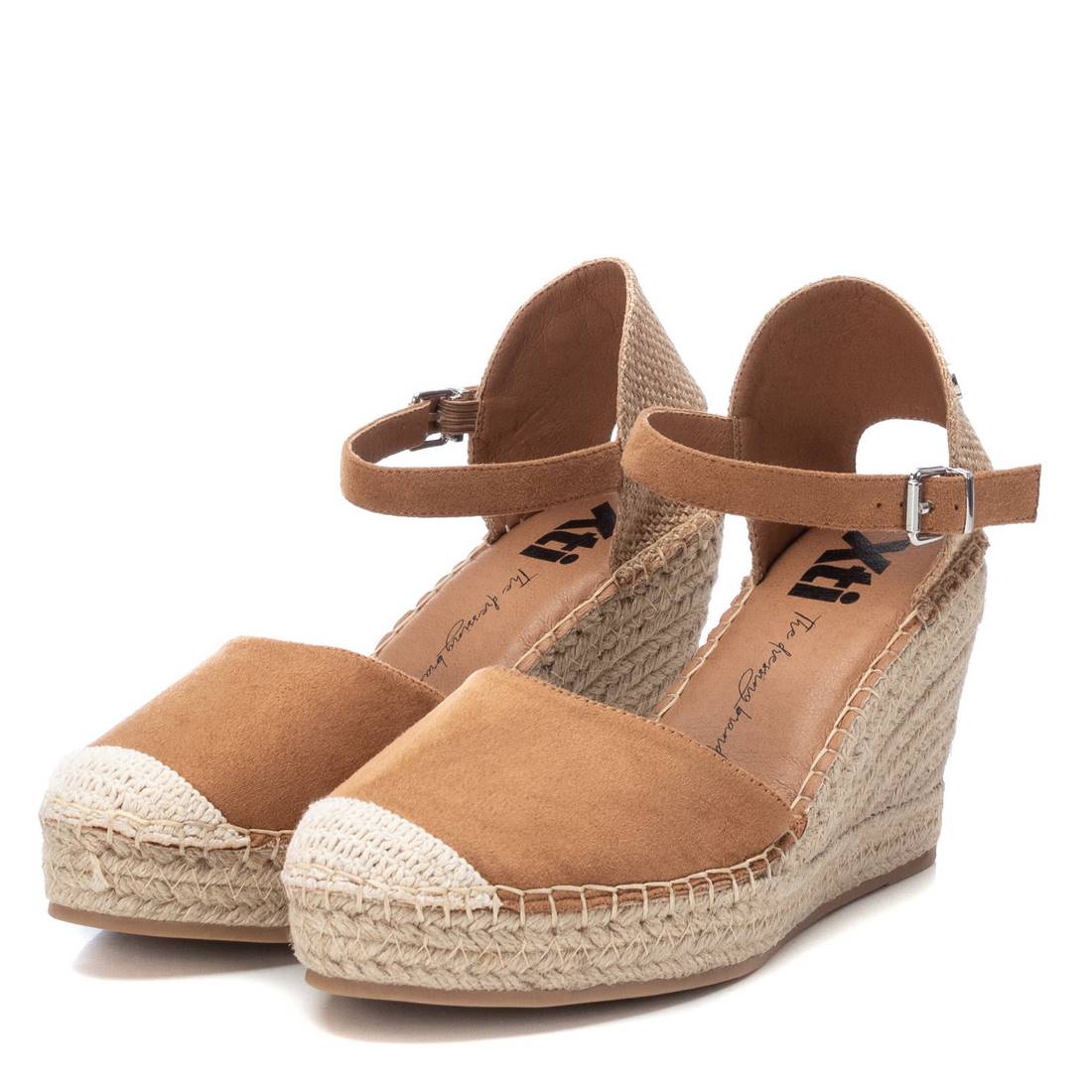 Close-up of the jute-wrapped wedge and non-slip rubber sole for elegance and safety.