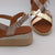 Lifestyle image of the sandals worn at a summer event, demonstrating their stylish versatility.