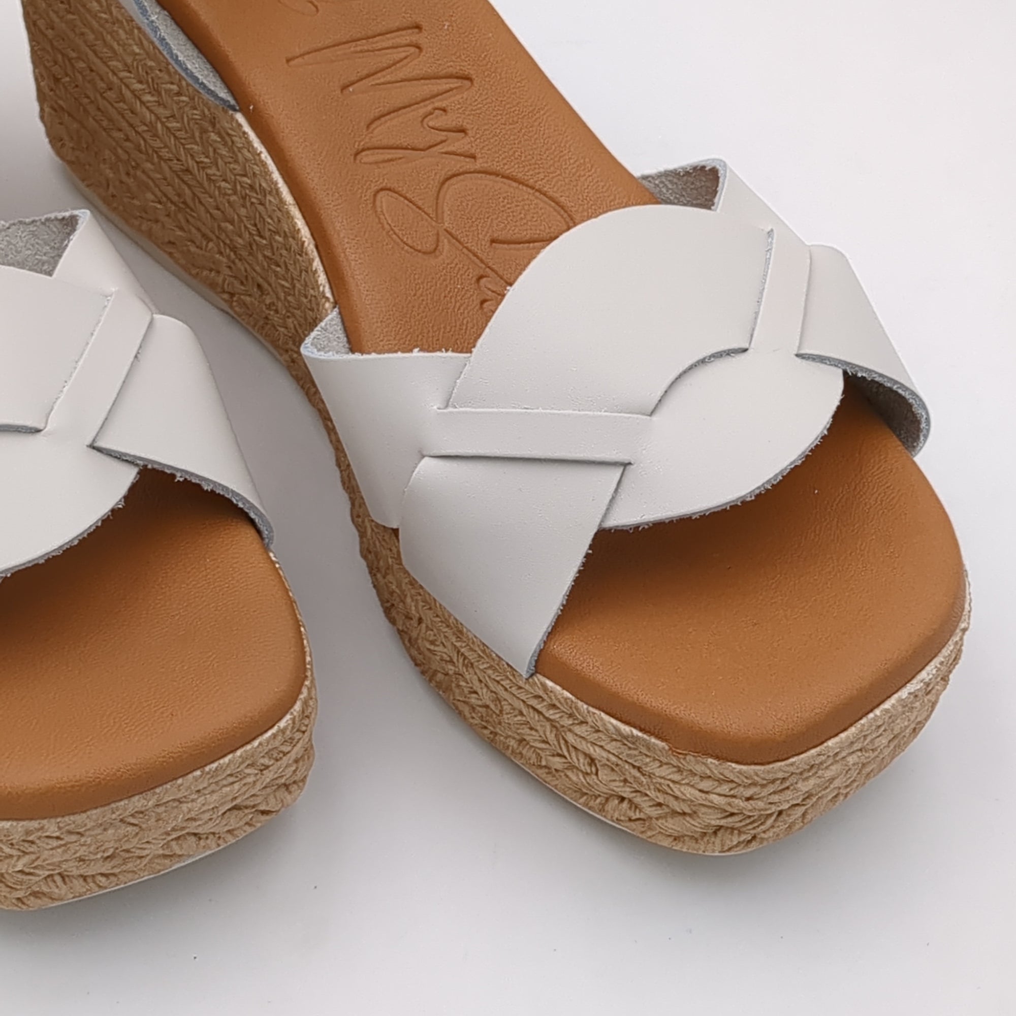 Front view of Oh My Sandals 5460 HIELO cream wedge sandals showing the unique crossover strap.
