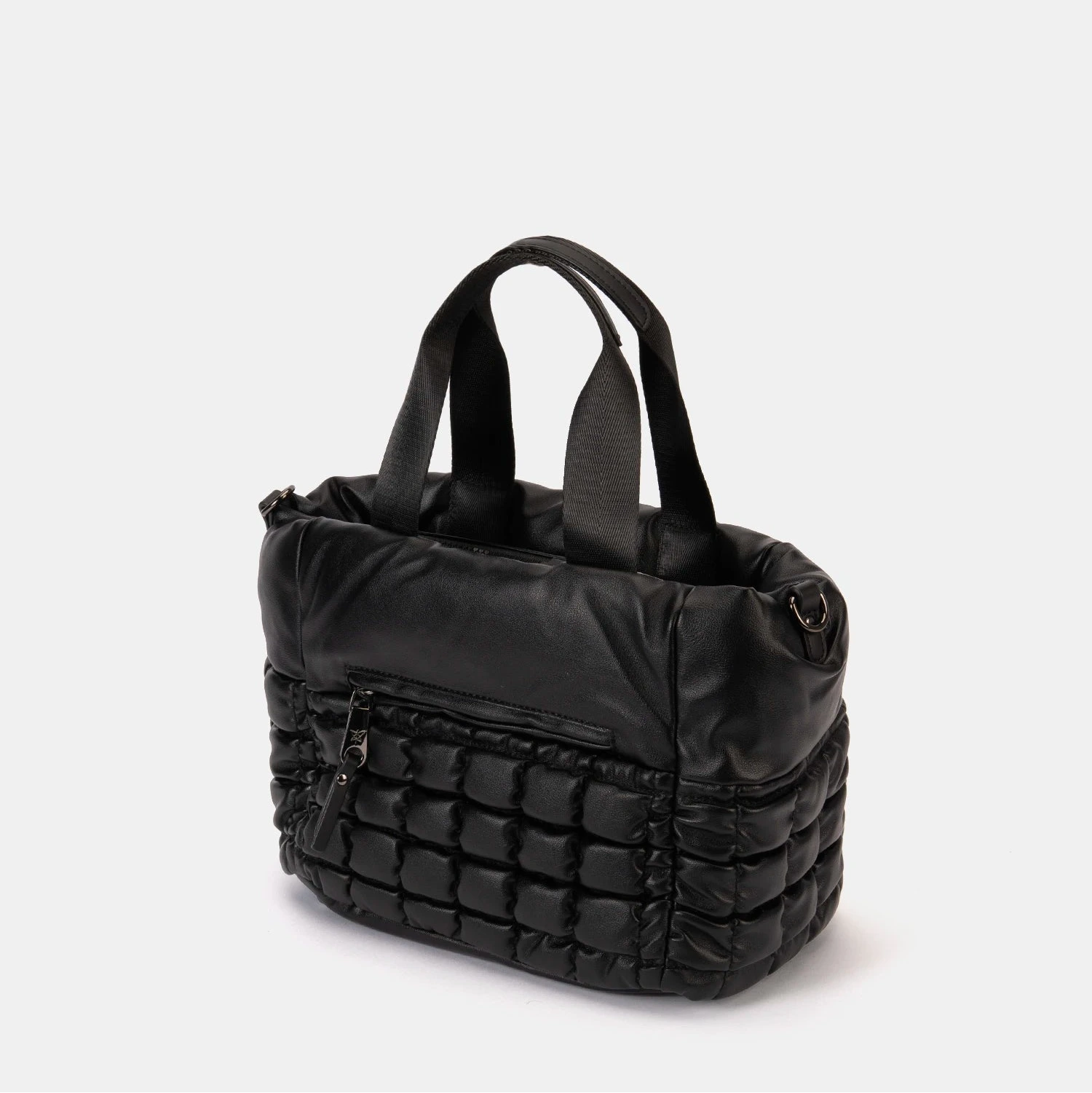 Black quilted handbag on a light gray background