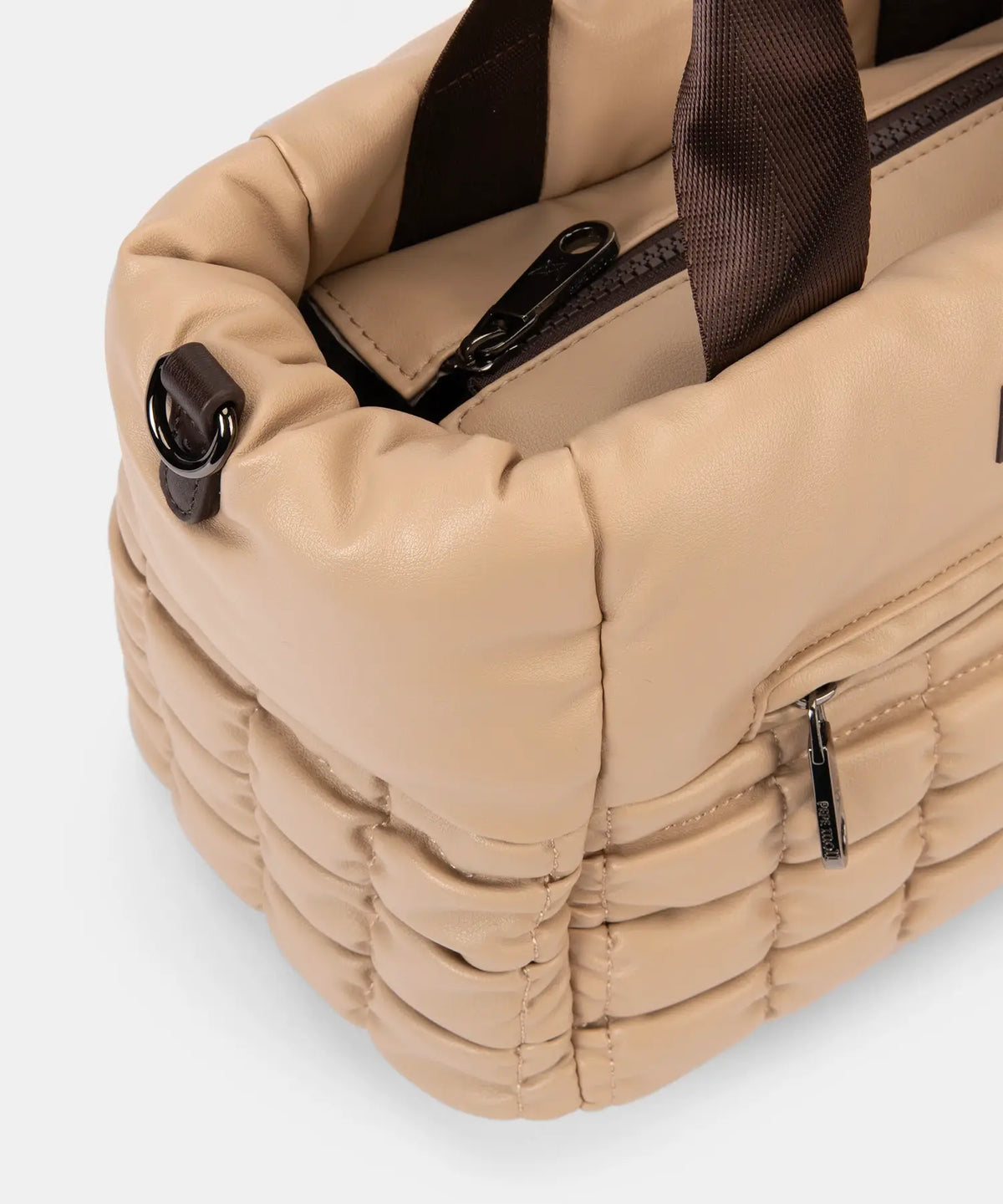 Beige quilted bag with brown accents on a white background