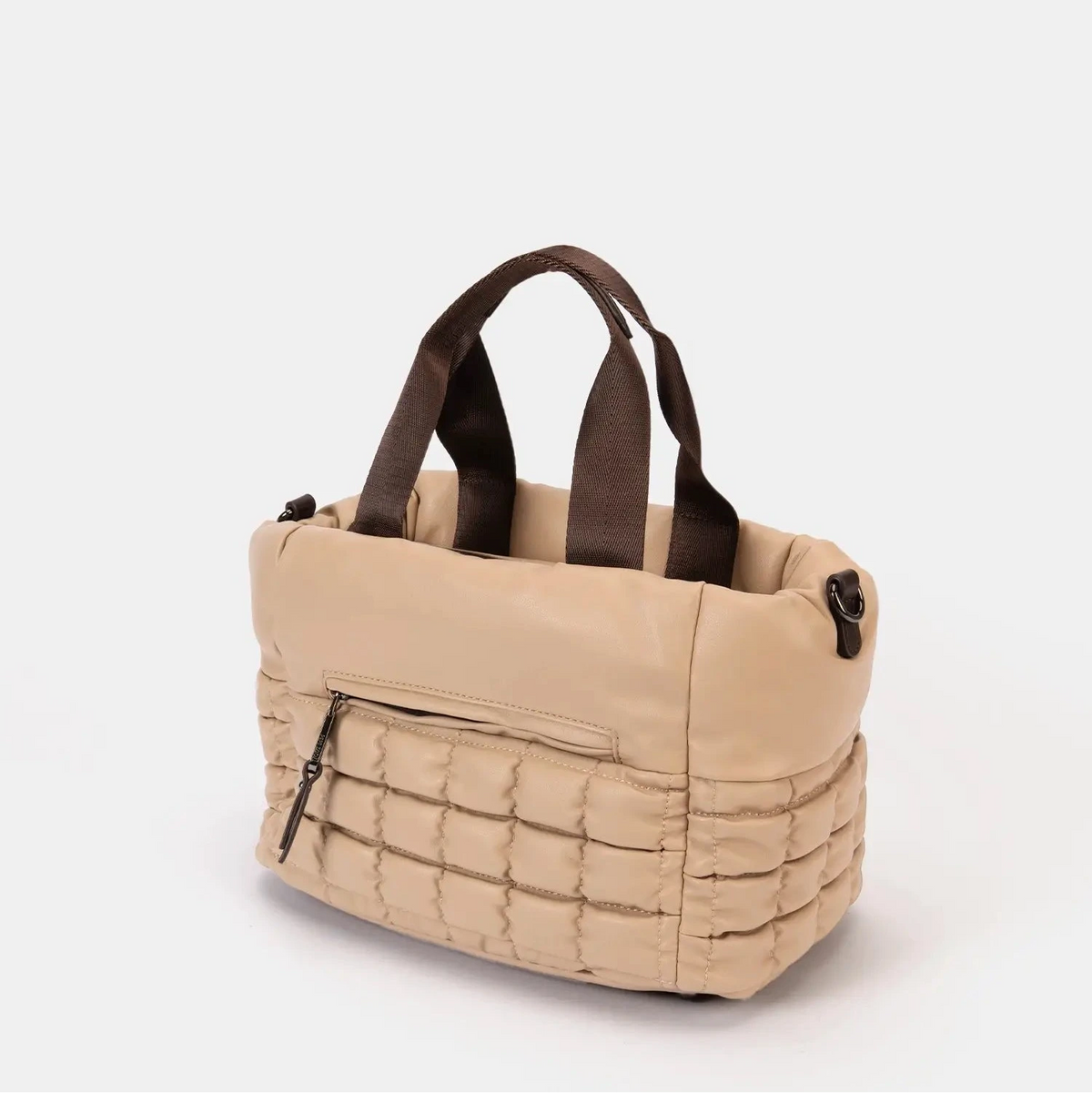 Beige tote bag with brown handles on a white background