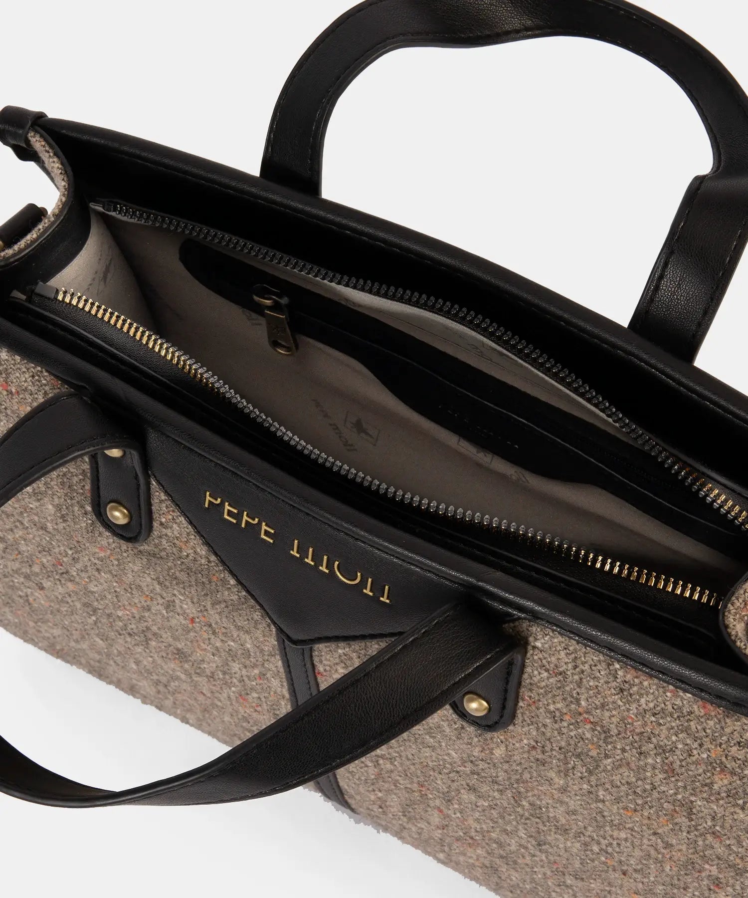 Black handbag with visible brand name on a white background