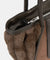 Close-up of a brown fur-lined handbag with a visible brand logo.