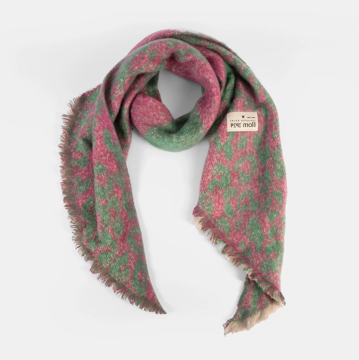 Green and pink patterned scarf on a white background
