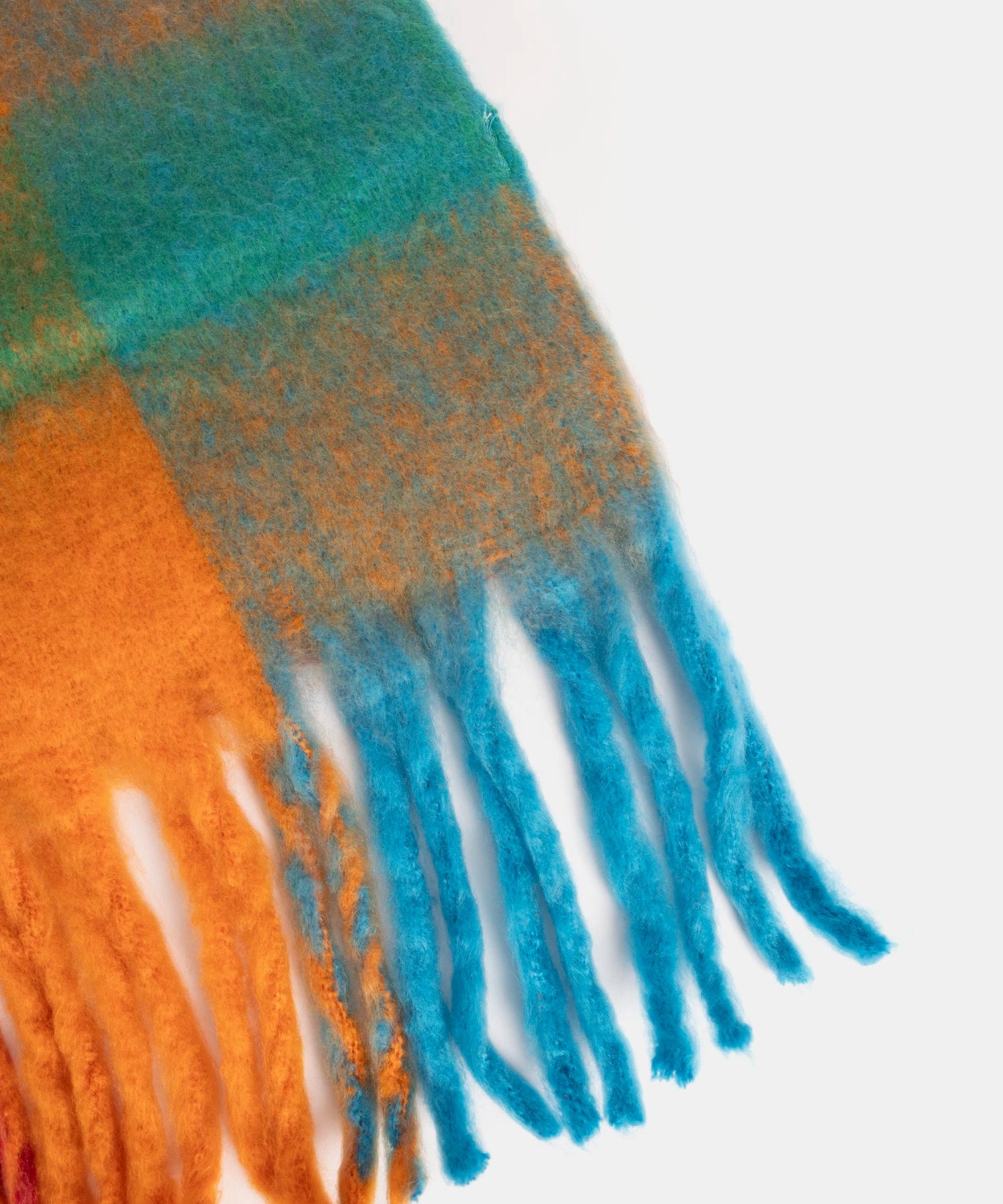 Multicolored scarf with fringes on a white background