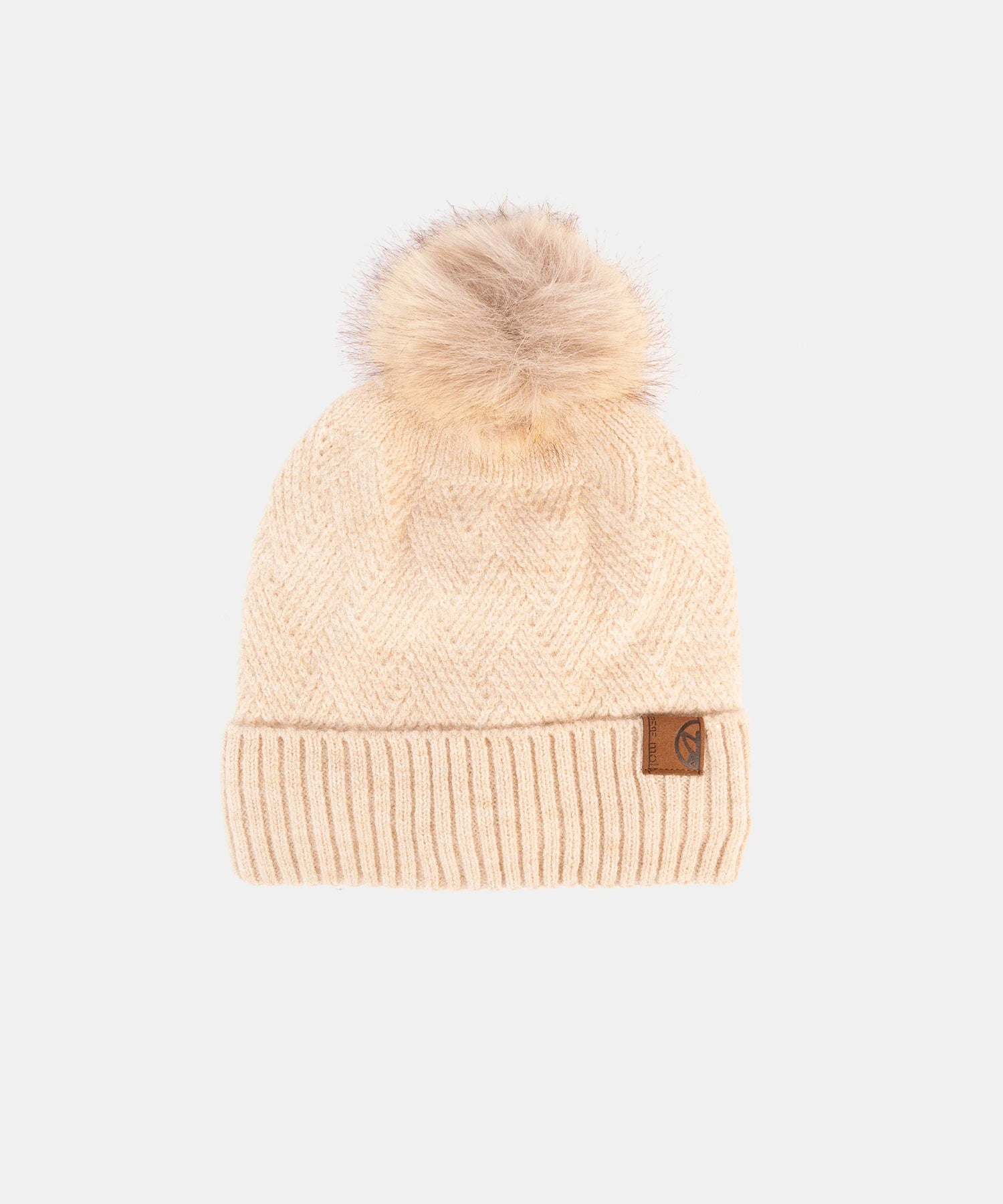 Beige knit beanie with a pom-pom on a white background