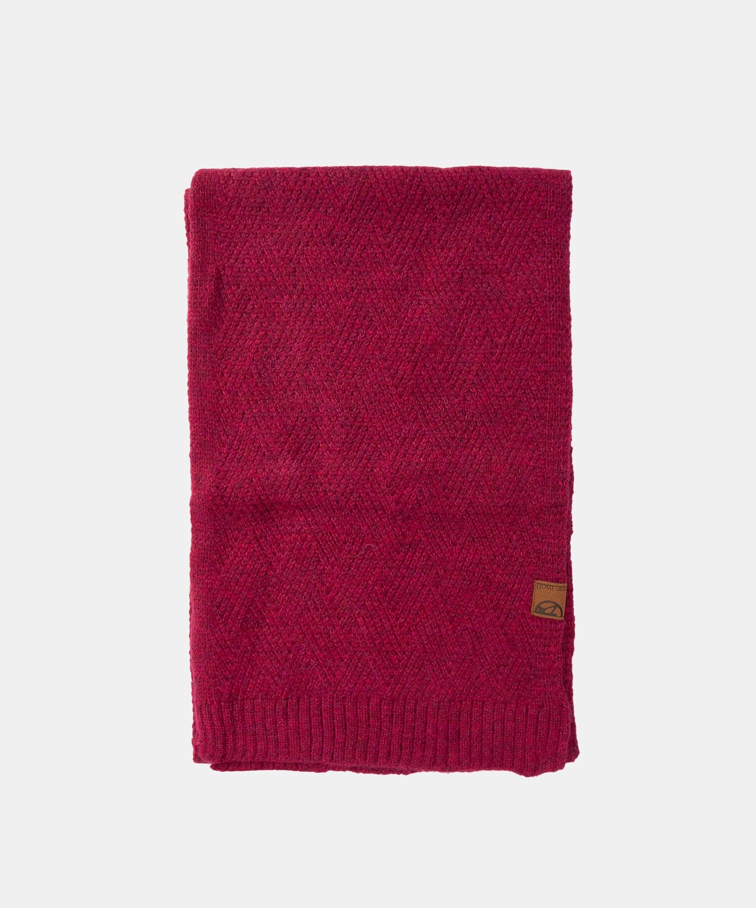 Maroon knitted scarf with a brand logo on a light gray background