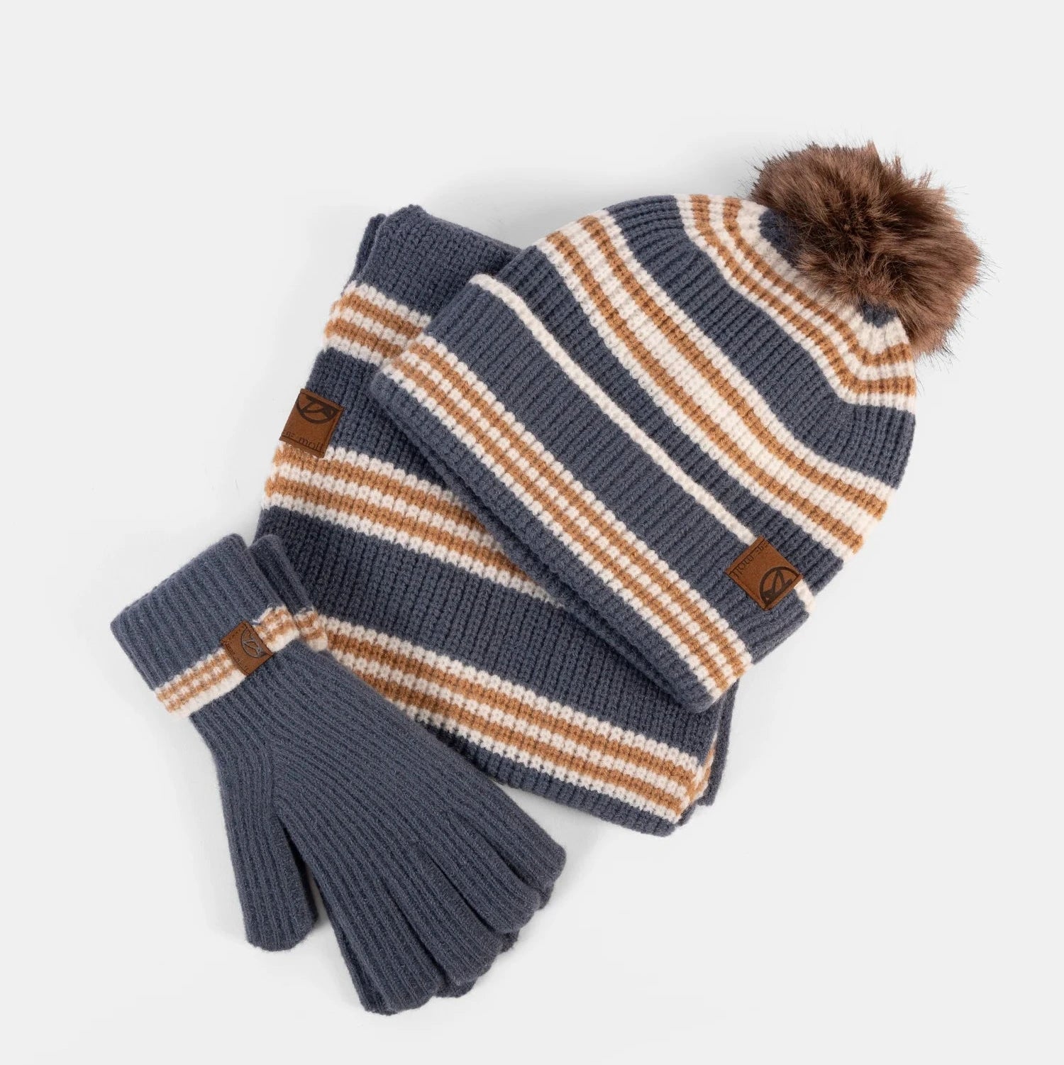 Knitted hat, scarf, and gloves set with brown accents on a white background