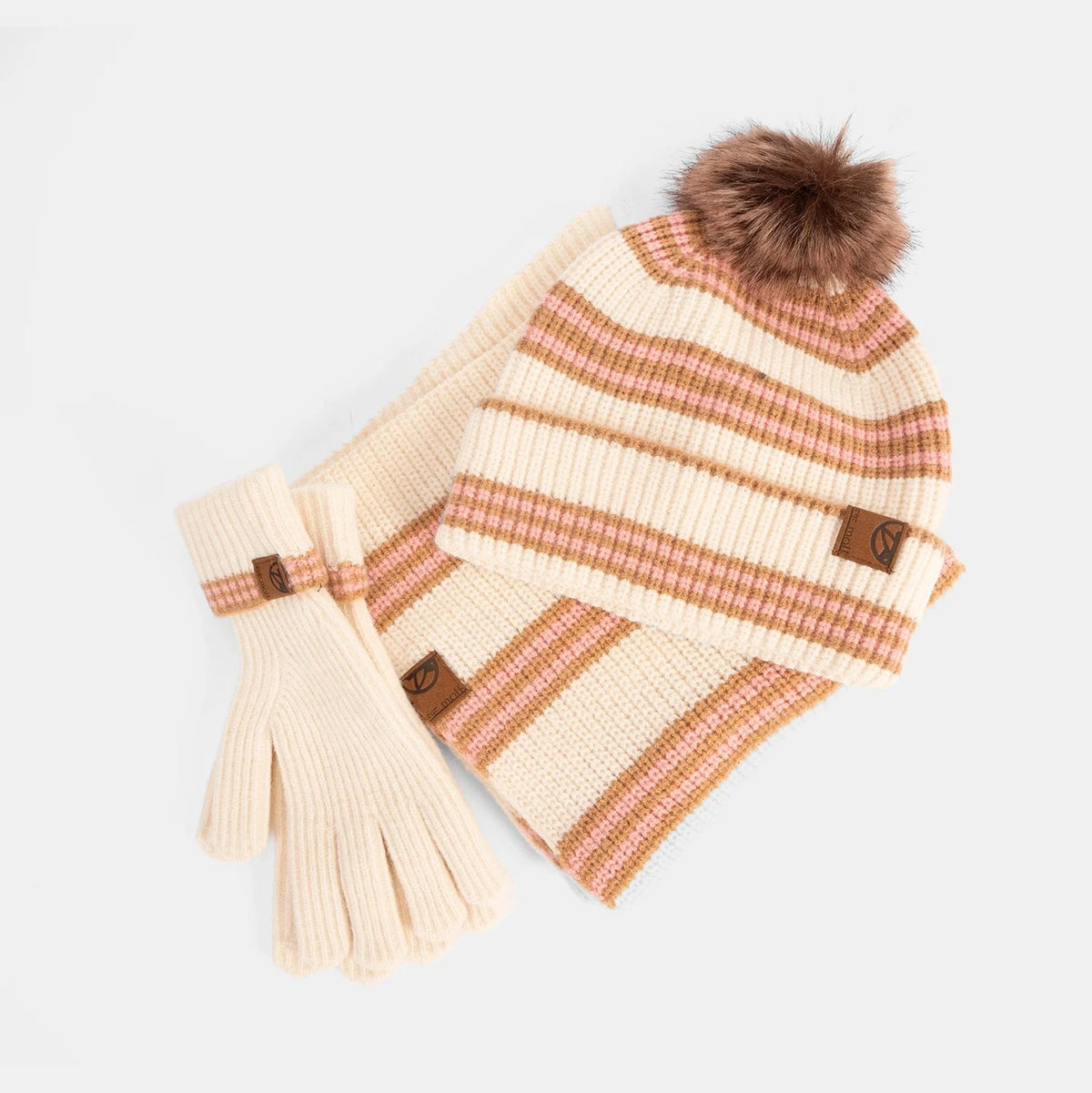 Knitted hat and scarf set with fur pom-pom on a white background