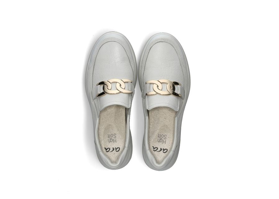 Detailed view of the sport sole and classic upper design of the Ara white slip-on sneakers.