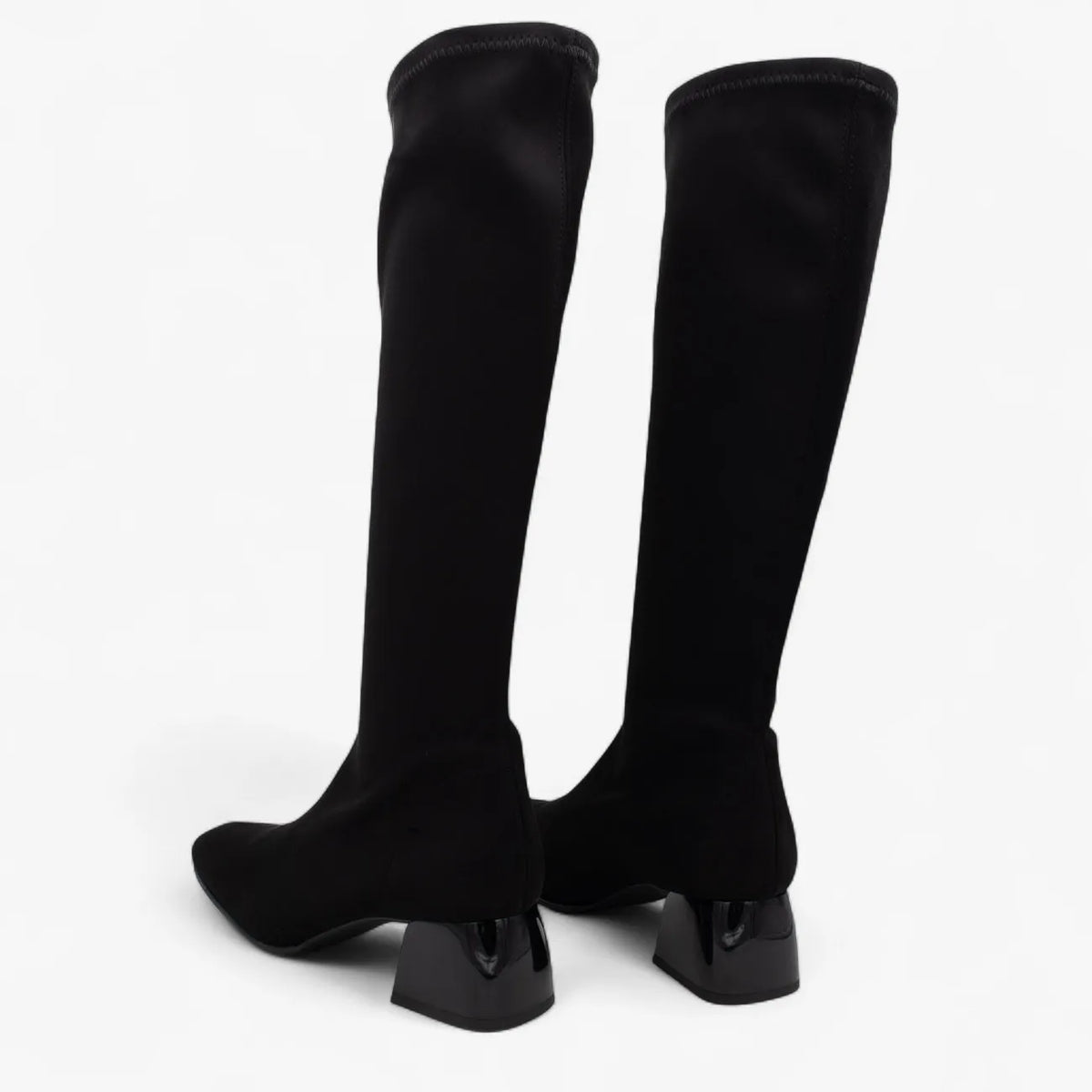 Black knee-high boots on a white background