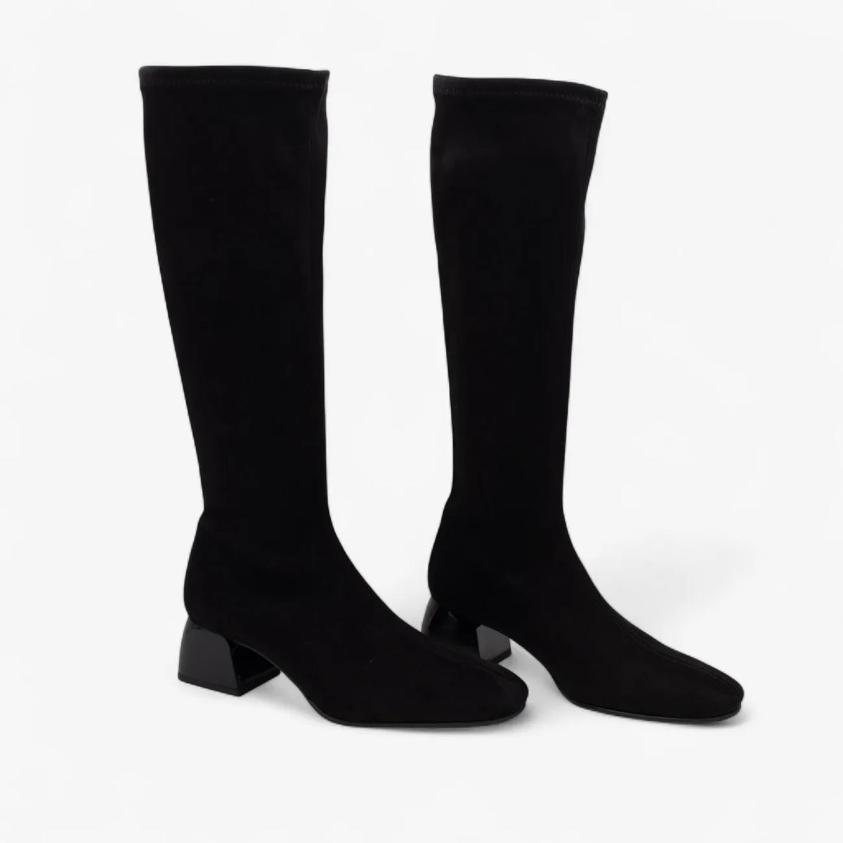 Pair of black knee-high boots on a white background