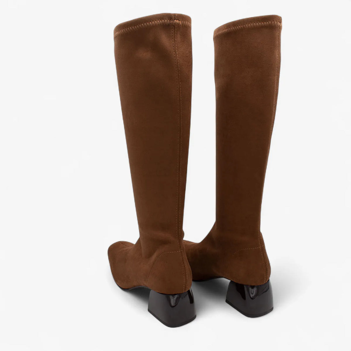 Pair of brown knee-high boots on a white background