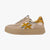 Beige sneaker with gold and white accents on a white background