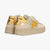 Beige sneakers with gold accents on a white background